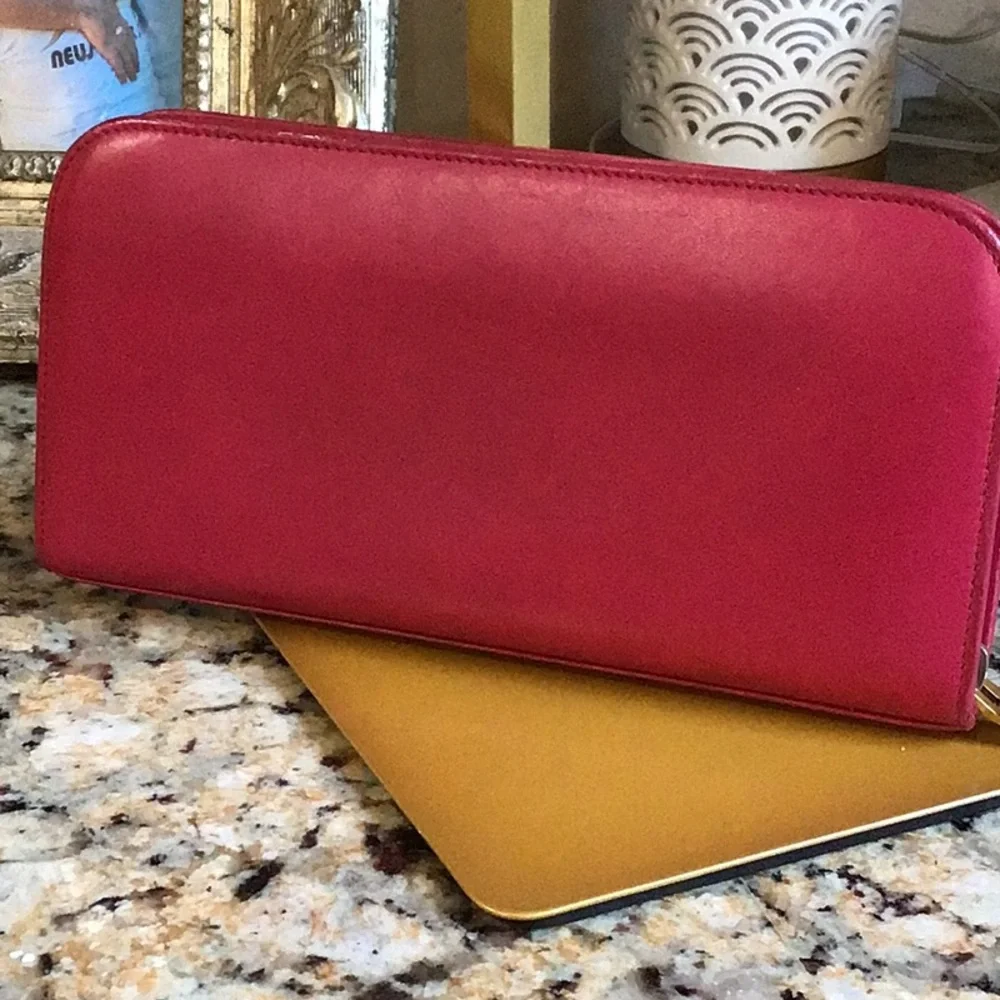 Saint Laurent. pink zippy lambskin wallet gold tone hardware